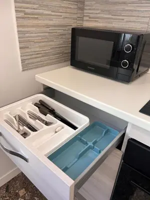 a drawer in a kitchen with a microwave at Smart Home in Rome