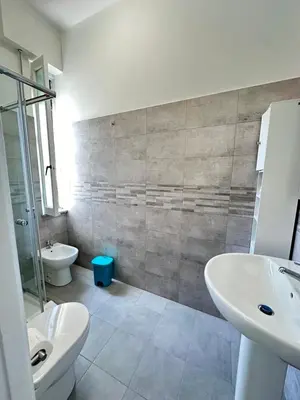 a bathroom with a sink and a toilet at Smart Home in Rome