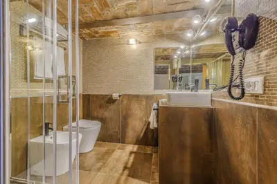 a bathroom with a toilet and a sink at Home at Rome Luxury Navona Suites in Rome