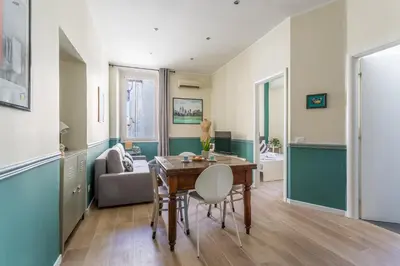 a living room with a table and a couch at iFlat Retro Style Apartment near the Vatican in Rome