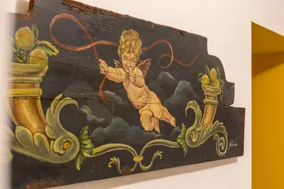 a painting of a woman on a wall at iFlat Baroque Apartment in Campo de' Fiori in Rome