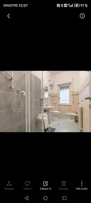 a bathroom with two sinks and a shower in it at House Grimaldi in Rome