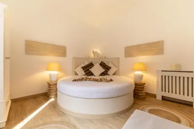 a bedroom with a bed with green curtains at Vatican Borgo Pio Splendid Apartment in Rome