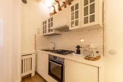 a bathroom with a toilet in a room at Vatican Borgo Pio Splendid Apartment in Rome