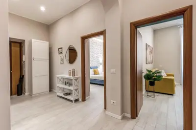 a hallway with a room with a bed and a mirror at Pretorius Charming New Apt in Rome