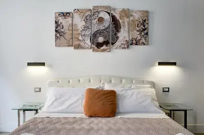 a bedroom with a bed with two side tables at Domus Capitolina Campo De' Fiori in Rome