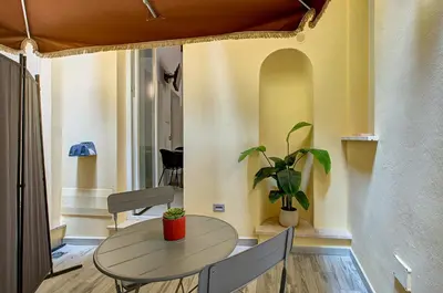 a dining room with a table and two chairs at Domus Capitolina Navona in Rome