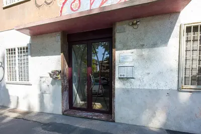 an entrance to a building with a glass door at Apartment Metro San Paolo -Air Conditioning-WIFI-TV55