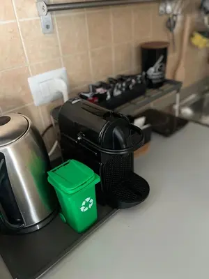 a kitchen counter with a coffee maker and a pot at Maison LuCe in Rome