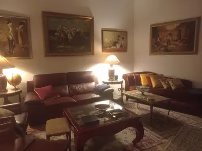 a living room with a couch and a table at Fiore73 in Rome