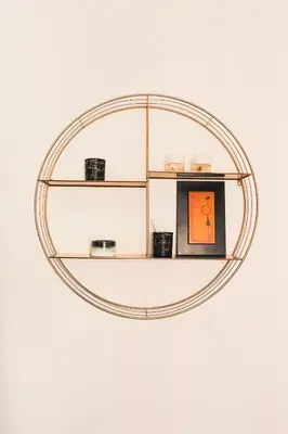 a round shelf with a picture on a wall at Orange Nest in Rome