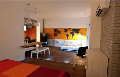 a bedroom with a bed and a desk with a laptop at St Peter apartment - Sister's Place in Rome