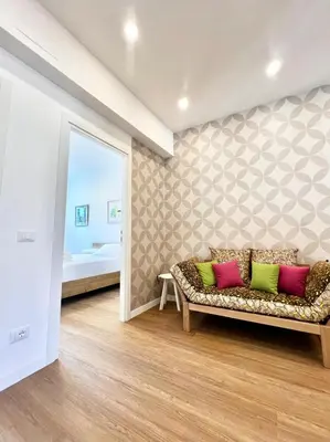 a living room with a couch and a bedroom at Doria home-Saint Peter's View in Rome