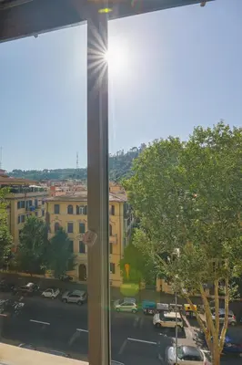 a window with a view of a parking lot at Clodia Vatican House in Rome