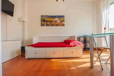 a bedroom with a bed with a red mattress at Clodia Vatican House in Rome