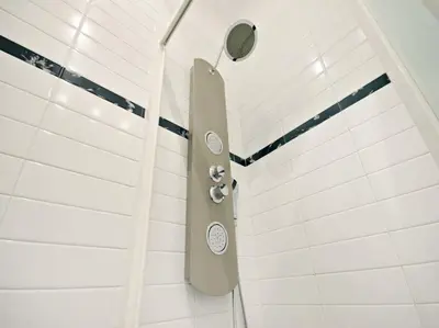 a shower with a shower head in a bathroom at Velvet Trastevere Apartment in Rome
