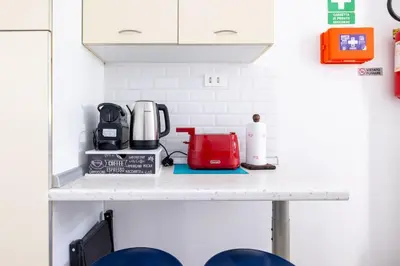 a kitchen counter with a coffee maker on it at Casa Gemelli - Metro per il centro di Roma - in Rome