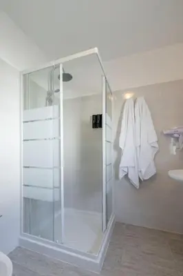 a bathroom with a glass shower and a sink at Casa Gemelli - Metro per il centro di Roma - in Rome