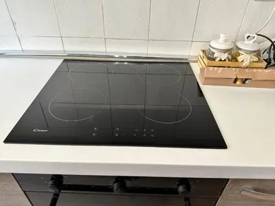 a black microwave sitting on top of a counter at Roma Chic Cattolica Gemelli in Rome