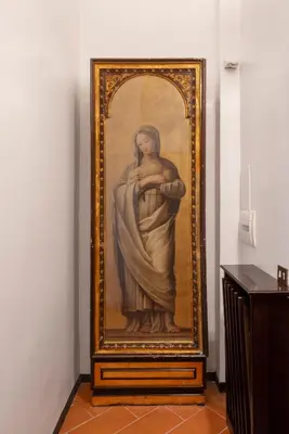 a picture of a statue of a woman on a wall at Anima Beauty House in Rome