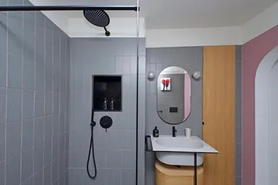 a bathroom with a shower and a sink and a mirror at 4BNB - Luxury Navona Apartment in Rome