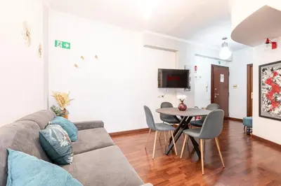 a living room with a couch and a table at Maisonette Trastevere Wonderful Apartment - Top Collection in Rome