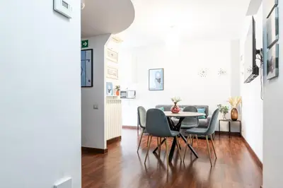 a dining room with a table and chairs at Maisonette Trastevere Wonderful Apartment - Top Collection in Rome