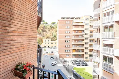 an apartment balcony with a view of a parking lot at Maisonette Trastevere Wonderful Apartment - Top Collection in Rome