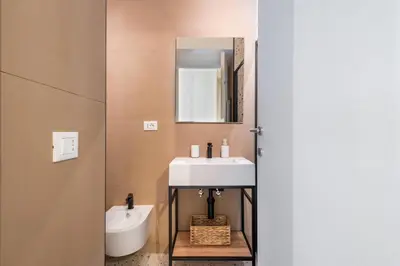 a bathroom with a sink and a mirror at FAMM - Cozy flat in Trastevere in Rome