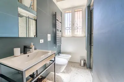 a bathroom with a sink and a toilet at FAMM - Cozy flat in Trastevere in Rome