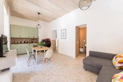 a living room with a couch and a table at FAMM - Cozy flat in Trastevere in Rome