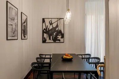 a dining room table with a bowl of fruit on it at Toscana 5 - FromHometoRome in Rome