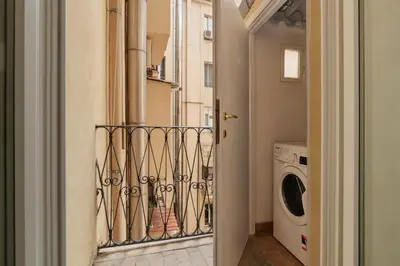 a laundry room with a washer and dryer at Toscana 5 - FromHometoRome in Rome