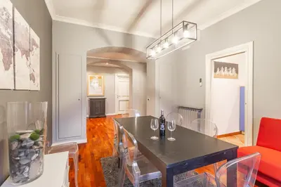 a dining room with a table and chairs at The Vatican Dream 3BDR Apartment in Rome