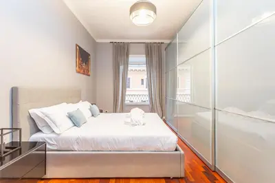 a bedroom with a bed and a window at The Vatican Dream 3BDR Apartment in Rome
