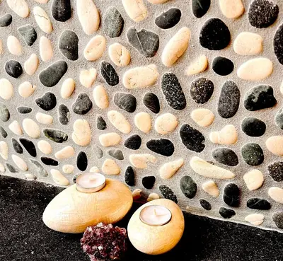 a group of shells and rocks on a metal surface at Everlasting Zen Home in San Giovanni Rome in Rome