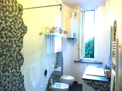a bathroom with a shower and a toilet and a sink at Everlasting Zen Home in San Giovanni Rome in Rome