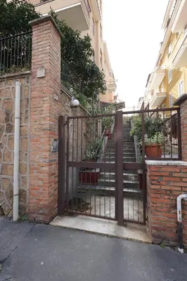 an entrance to a building with an iron gate at St Pietro city center near subway in Rome