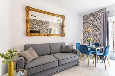 a living room with a couch and a mirror at iFlat Cozy and Elegant apt near Spanish Steps in Rome
