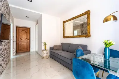 a living room with a couch and a glass table at iFlat Cozy and Elegant apt near Spanish Steps in Rome