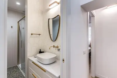 a bathroom with a sink and a mirror at 3 bedroom apartment Via Genova Monti area in Rome