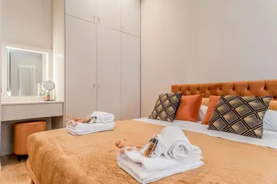 a bedroom with a bed with towels on it at Augusto Imperatore Luxury Suite in Rome