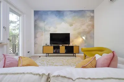 a living room with a tv and a couch at YCH-La tua casa dei sogni al Vaticano in Rome
