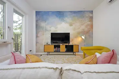 a living room with a tv and a couch at YCH-La tua casa dei sogni al Vaticano in Rome