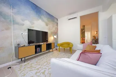 a living room with a tv on a wall at YCH-La tua casa dei sogni al Vaticano in Rome