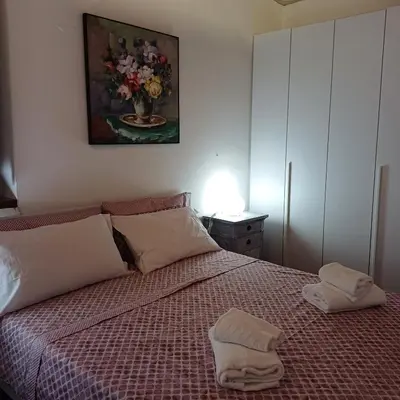 a bedroom with a bed with two towels on it at Conti Ripetta house in Rome