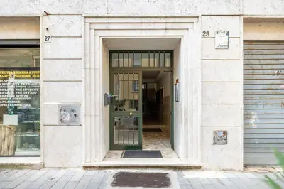 an entrance to a building with a glass door at STRACULT HOUSE Suggestive and Vintage-pop Apartment in Rome