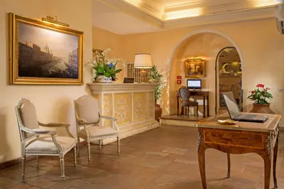 a room with a desk with a laptop on it at Hotel Mozart in Rome