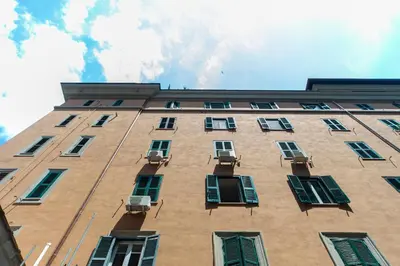 a tall building with windows on the side of it at Flaminio District Holiday Home in Rome