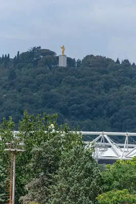 a cross on top of a hill with trees at Flaminio District Holiday Home in Rome